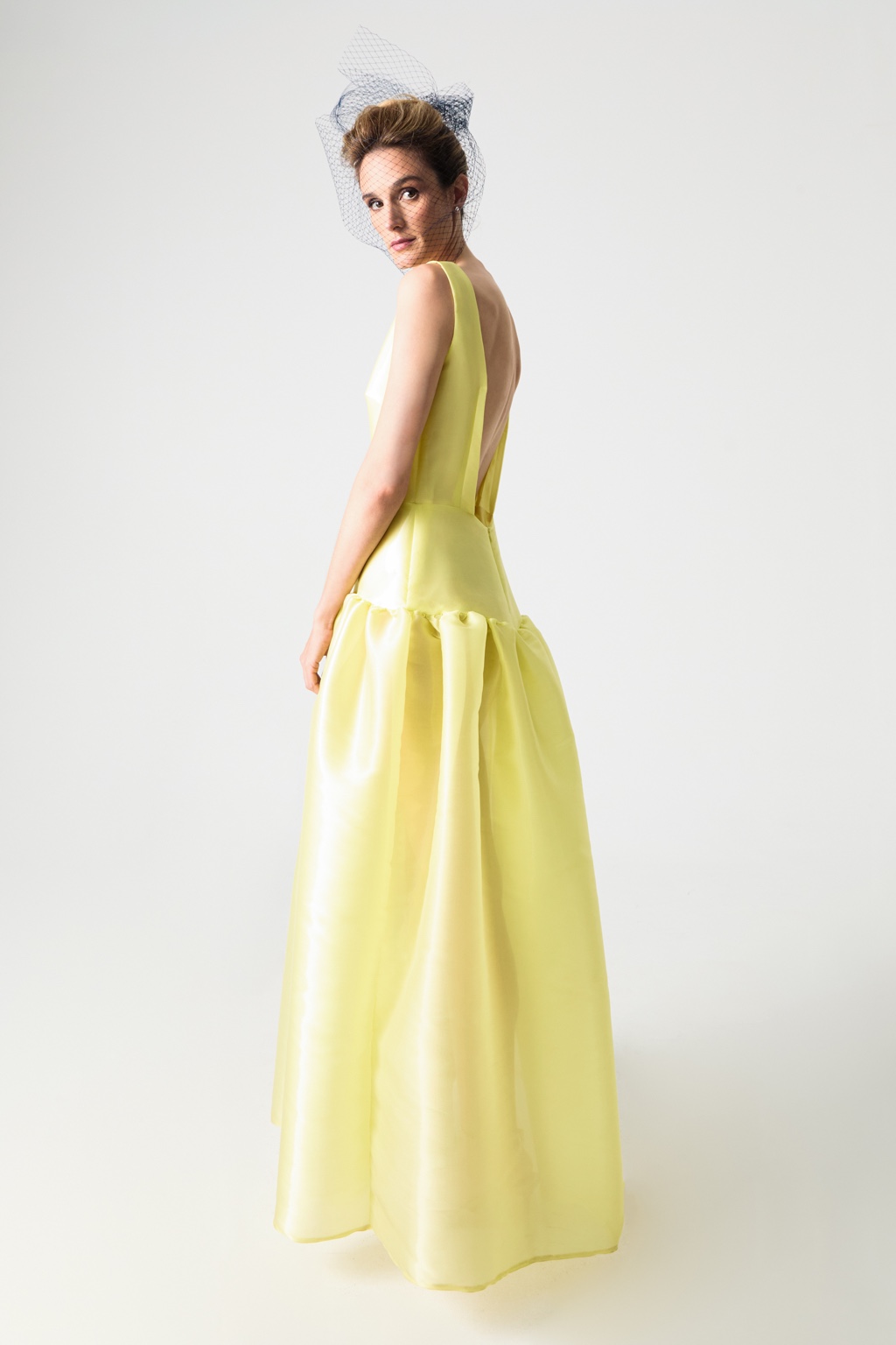 Yellow evening dress viewed from the back by Fely Campo